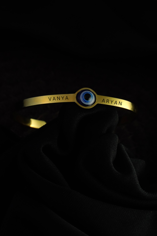 Gift for Couple - Custom Evil Eye Bracelets with engraved names on flat lay